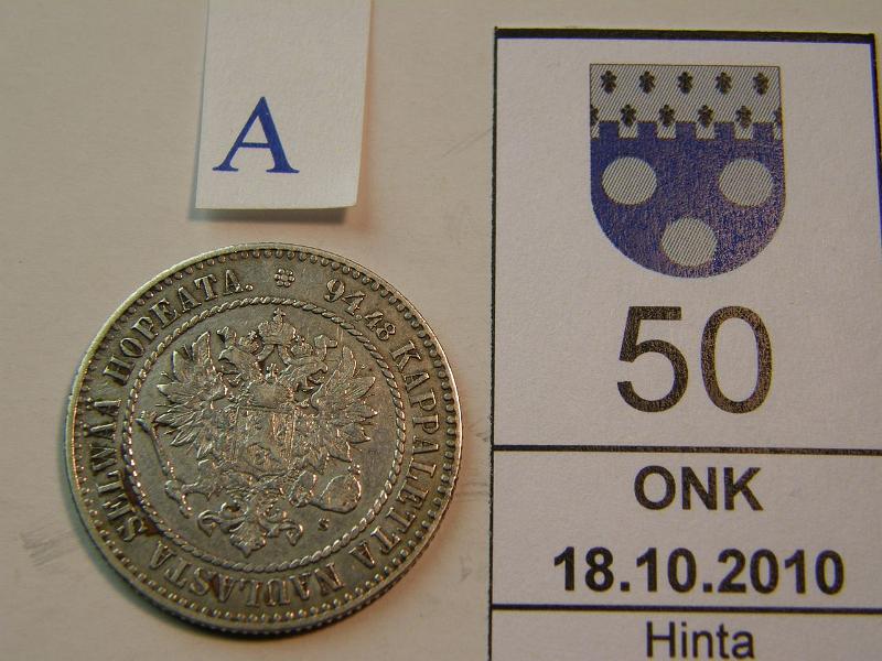 kohde_050_a.jpg - Kohde 50, tunnuspuoli, lhthinta: 100 € 1 mk 1864 SNY 397.2, hpja, l.puhd, kunto: 4/5.