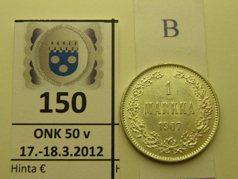 k-0150-b.jpg - Kohde 150 (kuva 2/2), lhthinta: 30 € / myyntihinta: 40 € 1 mk 1907 Ag, hnja, leimakiiltoa, kunto: 8