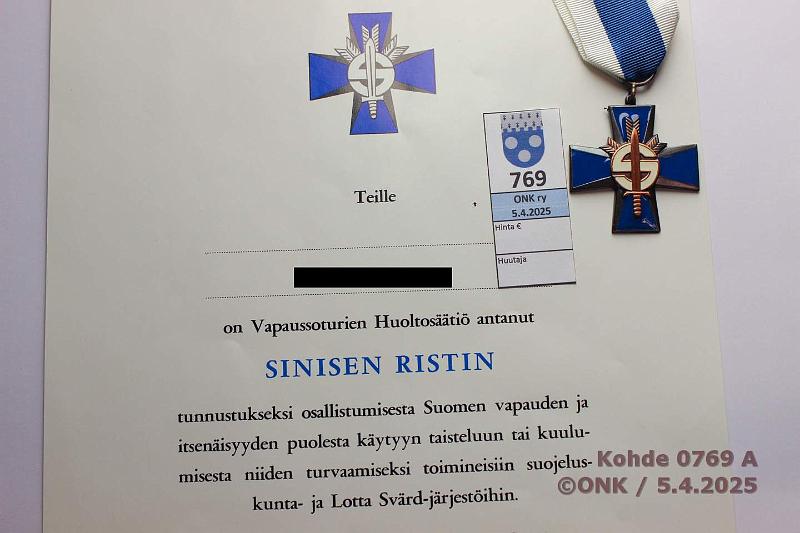 k-0769-a.jpg - Kohde 769 (kuva 1/2), lhthinta: 10 € Sininen risti Myntkirja, kunto: 9